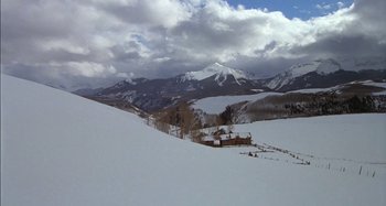 Movie still from “Butch and Sundance: The Early Days” (1979), directed by Richard Lester – A snowy landscape with mountains in the background; Extreme Wide shot, High angle