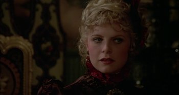 Movie still from “Butch and Sundance: The Early Days” (1979), directed by Richard Lester – A person wearing a dress; Close Up shot, Over the shoulder angle