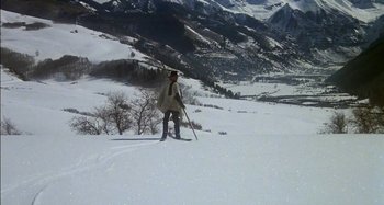 Movie still from “Butch and Sundance: The Early Days” (1979), directed by Richard Lester – A person on skis on a snowy slope; Extreme Wide shot, High angle