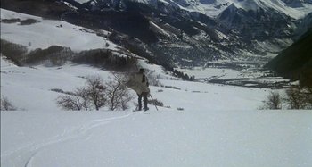 Movie still from “Butch and Sundance: The Early Days” (1979), directed by Richard Lester – A person on skis on a snowy slope; Extreme Wide shot, High angle