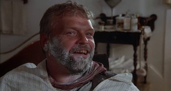 Movie still from “Butch and Sundance: The Early Days” (1979), directed by Richard Lester – A person with a beard; Close Up shot, Low angle