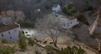 Movie still from “Butch and Sundance: The Early Days” (1979), directed by Richard Lester – An aerial view of people and animals in a field; Extreme Wide shot, High angle