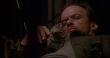 Movie still from “Butch and Sundance: The Early Days” (1979), directed by Richard Lester – A man laying on the ground with his head on his shoulder; Close Up shot, High angle