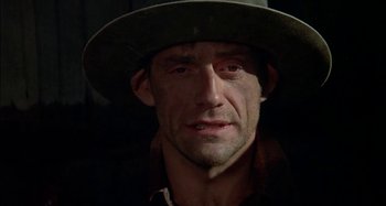 Movie still from “Butch and Sundance: The Early Days” (1979), directed by Richard Lester – A person wearing a hat and looking sad; Close Up shot, Low angle