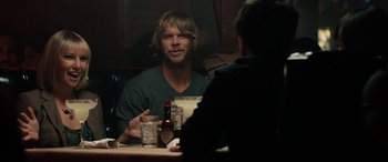 Movie still from “Celeste & Jesse Forever” (2012), directed by Lee Toland Krieger – A man sitting at a table talking to another man in front of him; Medium shot, Over the shoulder angle