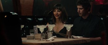 Movie still from “Celeste & Jesse Forever” (2012), directed by Lee Toland Krieger – A woman sitting at a table with three glasses of wine; Medium shot, Over the shoulder angle