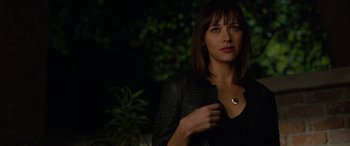 Movie still from “Celeste & Jesse Forever” (2012), directed by Lee Toland Krieger – A woman in a black shirt and a black leather jacket; Close Up shot, Over the shoulder angle