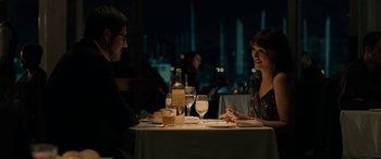 Movie still from “Celeste & Jesse Forever” (2012), directed by Lee Toland Krieger – A man and a woman sitting at a dinner table; Medium shot, Over the shoulder angle