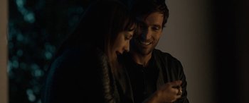 Movie still from “Celeste & Jesse Forever” (2012), directed by Lee Toland Krieger – A man and a woman looking at a cell phone; Close Up shot, Over the shoulder angle