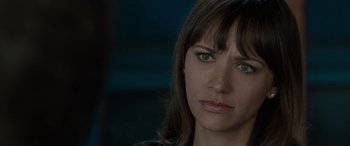 Movie still from “Celeste & Jesse Forever” (2012), directed by Lee Toland Krieger – A woman's face in a dark room; Close Up shot, Over the shoulder angle