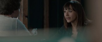 Movie still from “Celeste & Jesse Forever” (2012), directed by Lee Toland Krieger – A woman sitting at a table with a phone; Close Up shot, Over the shoulder angle