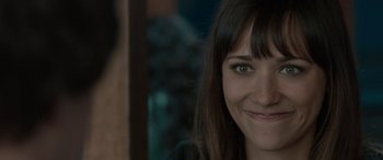 Movie still from “Celeste & Jesse Forever” (2012), directed by Lee Toland Krieger – A woman smiling for the camera; Close Up shot, Over the shoulder angle