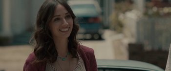 Movie still from “Celeste & Jesse Forever” (2012), directed by Lee Toland Krieger – A woman with long brown hair smiles for the camera; Close Up shot, Over the shoulder angle