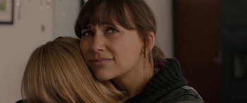 Movie still from “Celeste & Jesse Forever” (2012), directed by Lee Toland Krieger – A person with their arms around another person; Close Up shot, Over the shoulder angle