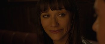 Movie still from “Celeste & Jesse Forever” (2012), directed by Lee Toland Krieger – A woman's face in a dimly - lit room; Close Up shot, Over the shoulder angle