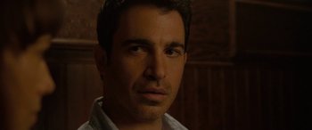 Movie still from “Celeste & Jesse Forever” (2012), directed by Lee Toland Krieger – A man's face in a dark room; Close Up shot, Over the shoulder angle