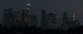 Movie still from “Celeste & Jesse Forever” (2012), directed by Lee Toland Krieger – A view of a city skyline at night time; Extreme Wide shot, High angle
