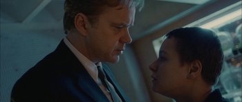 Movie still from “Code 46” (2003), directed by Michael Winterbottom – A man and a woman face to face in front of a window; Close Up shot, Over the shoulder angle