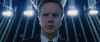 Movie still from “Code 46” (2003), directed by Michael Winterbottom – A person wearing a suit and tie; Close Up shot, Low angle