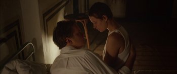 Movie still from “Code 46” (2003), directed by Michael Winterbottom – A man and a woman are looking at one another; Medium shot, High angle