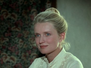 Movie still from “Cousin cousine” (1975), directed by Jean-Charles Tacchella – A woman with blonde hair and a white shirt; Close Up shot, High angle