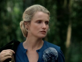 Movie still from “Cousin cousine” (1975), directed by Jean-Charles Tacchella – A woman with blonde hair wearing a blue shirt; Close Up shot, Over the shoulder angle