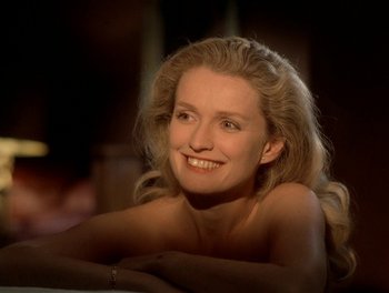 Movie still from “Cousin cousine” (1975), directed by Jean-Charles Tacchella – A woman with blonde hair smiling for the camera; Close Up shot, High angle