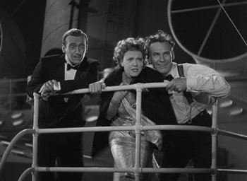 Movie still from “Dodsworth” (1936), directed by William Wyler – A group of people standing next to each other on a boat; Medium shot, Low angle