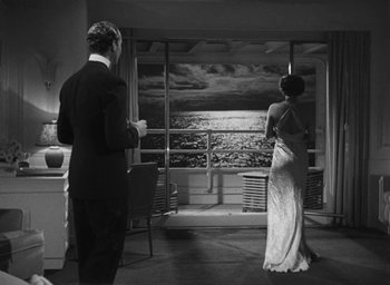 Movie still from “Dodsworth” (1936), directed by William Wyler – A man and a woman standing in front of a window; Wide shot, Low angle