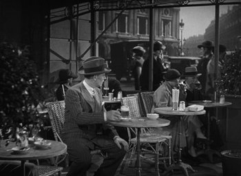 Movie still from “Dodsworth” (1936), directed by William Wyler – A group of men sitting at tables in a cafe; Wide shot, High angle