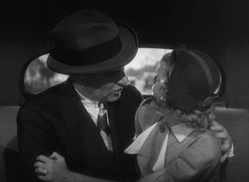 Movie still from “Dodsworth” (1936), directed by William Wyler – A man and a woman are talking in the back of a car; Medium shot, High angle