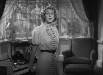 Movie still from “Dodsworth” (1936), directed by William Wyler – A black and white photo of a woman in a dress; Medium shot, Low angle