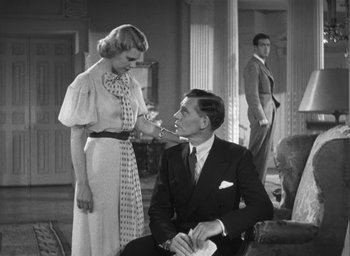 Movie still from “Dodsworth” (1936), directed by William Wyler – An old photo of a man and a woman; Medium shot, Low angle