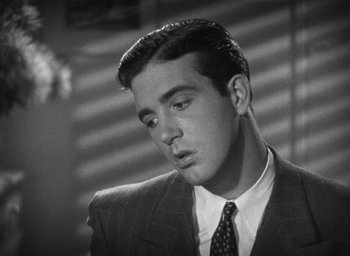 Movie still from “Dodsworth” (1936), directed by William Wyler – Black and white photograph of a man in a suit; Close Up shot, Low angle