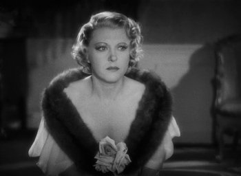 Movie still from “Dodsworth” (1936), directed by William Wyler – An old black and white photo of a woman wearing a fur stole; Close Up shot, Low angle