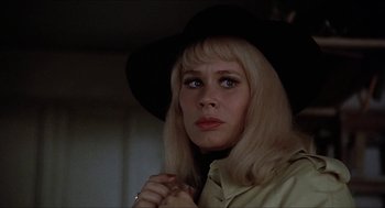 Movie still from “Family Plot” (1976), directed by Alfred Hitchcock – A woman in a black hat is looking at the camera; Close Up shot, Low angle