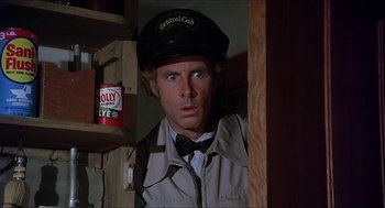 Movie still from “Family Plot” (1976), directed by Alfred Hitchcock – A person wearing a hat; Close Up shot, Low angle