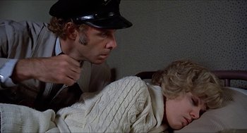Movie still from “Family Plot” (1976), directed by Alfred Hitchcock – A man and a woman in a room; Close Up shot, Over the shoulder angle