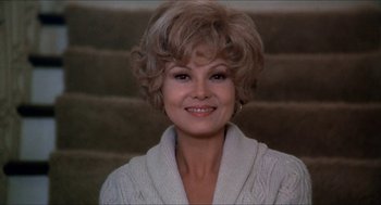 Movie still from “Family Plot” (1976), directed by Alfred Hitchcock – A person wearing a sweater; Close Up shot, Low angle