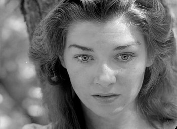 Movie still from “Fear and Desire” (1952), directed by Stanley Kubrick – A woman's face in black - and - white; Close Up shot, Low angle