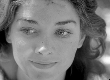 Movie still from “Fear and Desire” (1952), directed by Stanley Kubrick – A young woman's face in black and white; Extreme Close Up shot, High angle