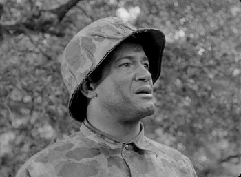 Movie still from “Fear and Desire” (1952), directed by Stanley Kubrick – Black and white photograph of a man wearing a hat; Close Up shot, Low angle