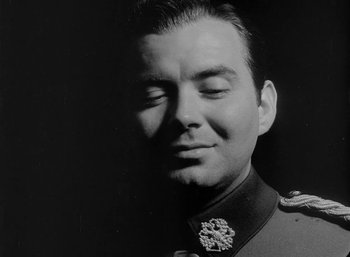 Movie still from “Fear and Desire” (1952), directed by Stanley Kubrick – A black and white photo of a man in a military uniform; Close Up shot, Low angle