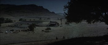 Movie still from “Flaming Star” (1960), directed by Don Siegel – An image of an old western town at night time; Extreme Wide shot, High angle