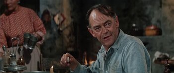 Movie still from “Flaming Star” (1960), directed by Don Siegel – An older man holding something in his hand; Close Up shot, Over the shoulder angle