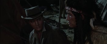 Movie still from “Flaming Star” (1960), directed by Don Siegel – A man and a woman in a field at night; Close Up shot, Over the shoulder angle