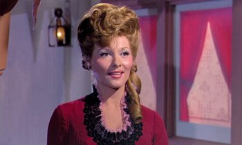 Movie still from “Frankie and Johnny” (1966), directed by Frederick De Cordova – A person wearing a dress; Close Up shot, Over the shoulder angle