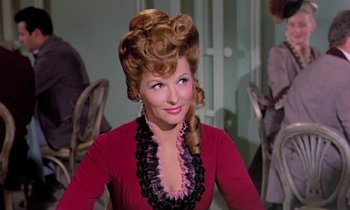 Movie still from “Frankie and Johnny” (1966), directed by Frederick De Cordova – A woman in a red dress with long hair; Close Up shot, Over the shoulder angle
