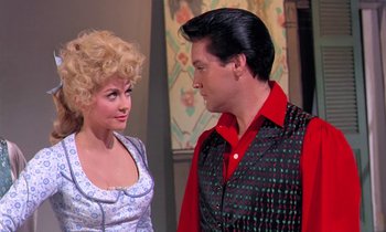 Movie still from “Frankie and Johnny” (1966), directed by Frederick De Cordova – A man and a woman are standing next to each other; Medium shot, Over the shoulder angle