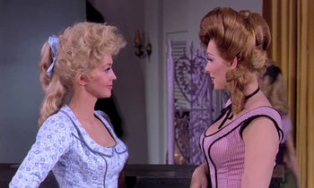 Movie still from “Frankie and Johnny” (1966), directed by Frederick De Cordova – A couple of women standing next to each other; Medium shot, Over the shoulder angle